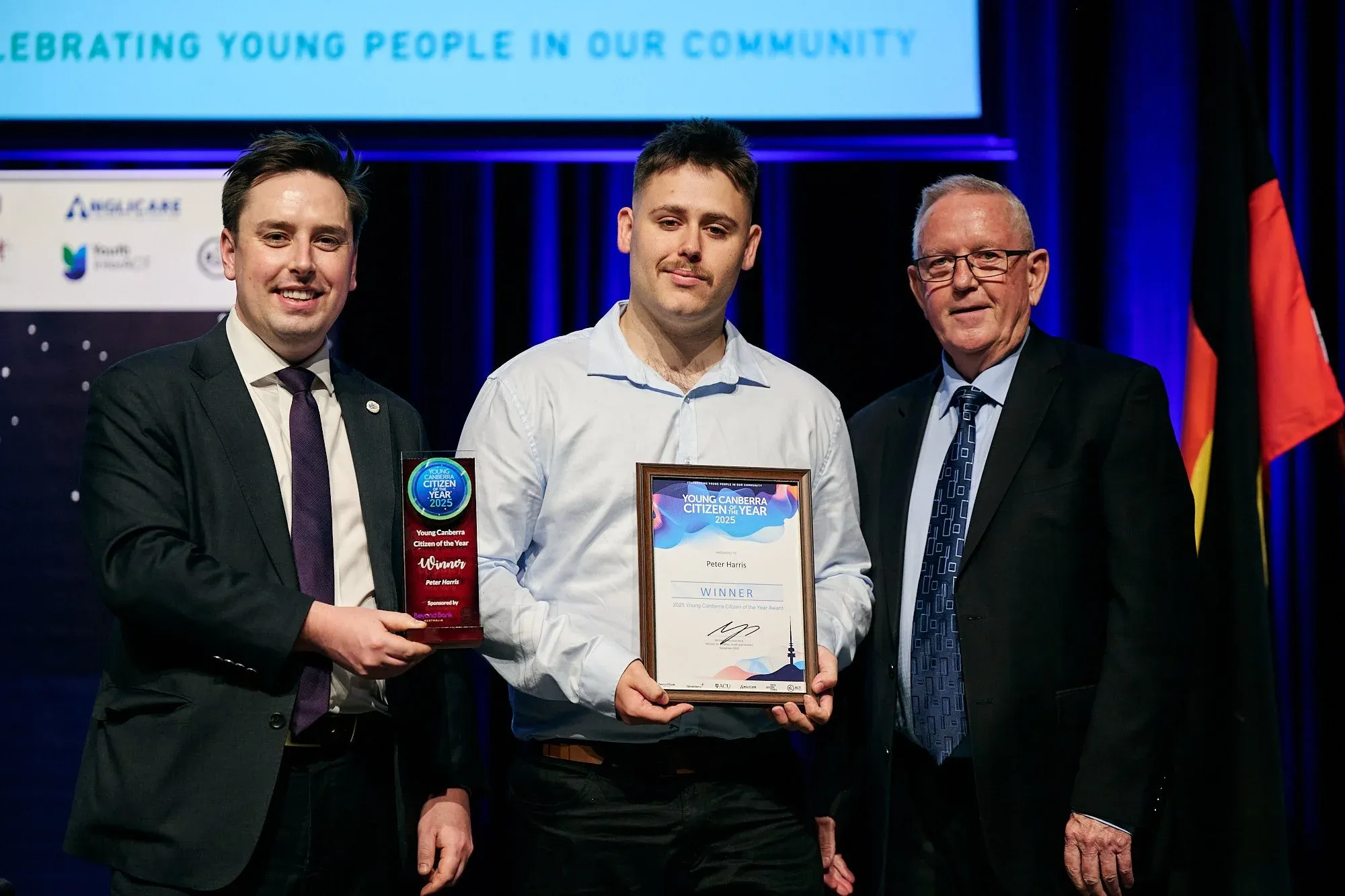 Peter Harris receiving the 2025 Young Canberra Citizen of the Year award